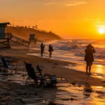 Crystal Cove closures scene with eroded beach access and shoreline barriers