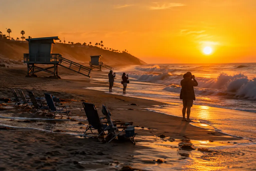 Crystal Cove closures scene with eroded beach access and shoreline barriers