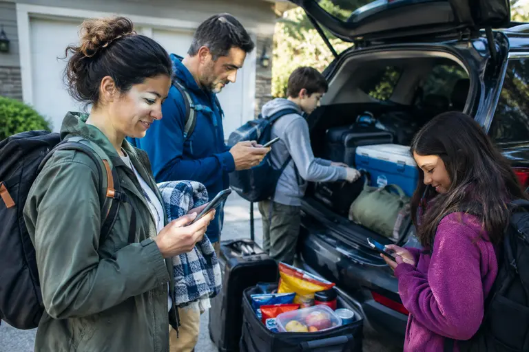 Family vehicle packed for a cross-border road trip